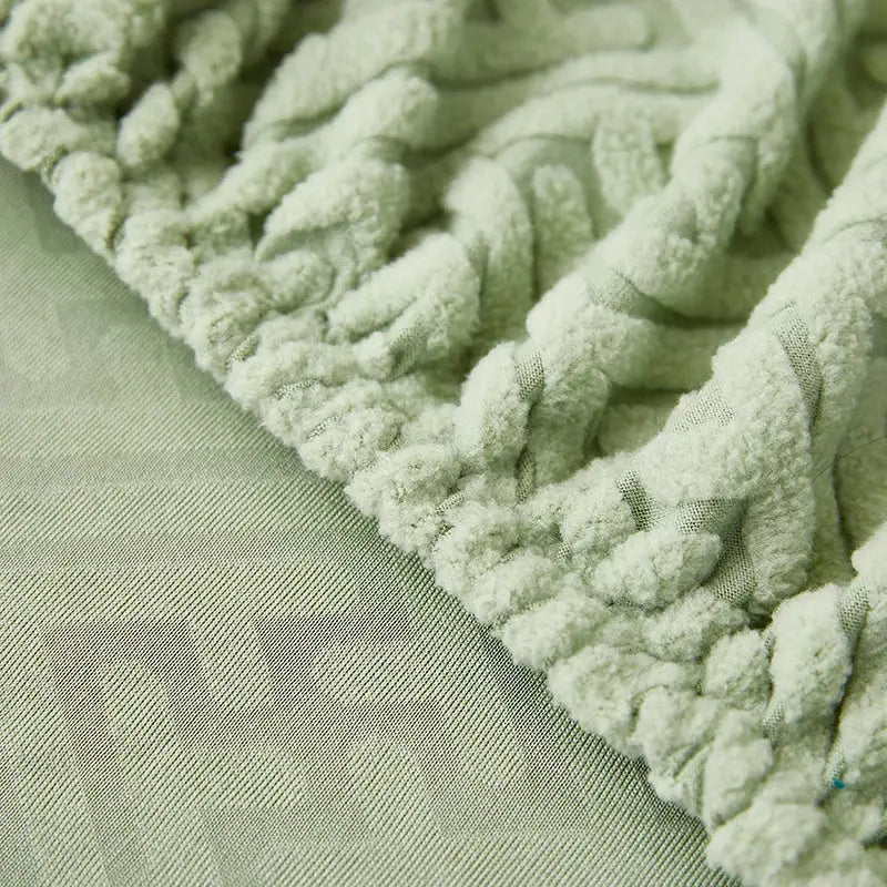 Sofa slipcover in mint green with plush looped fringe edge.