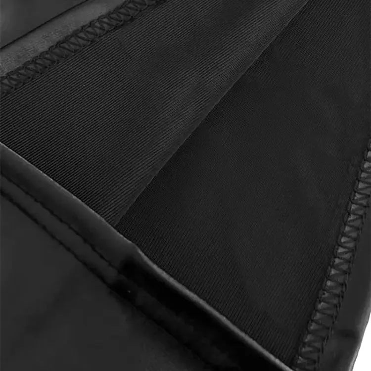 Black faux leather mini skirt with elastic waistband; close-up of stitching and fabric texture.