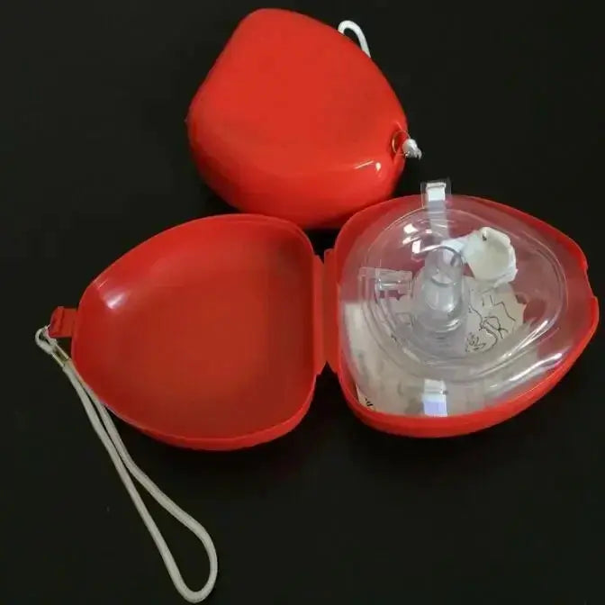 CPR mask set in a red heart-shaped case with a clear one-way valve for emergency first aid