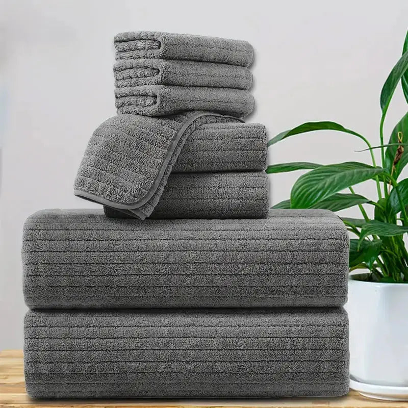 8-piece gray bath towel set with 4 washcloths, 2 face towels & 2 bath towels; absorbent & quick-dry.