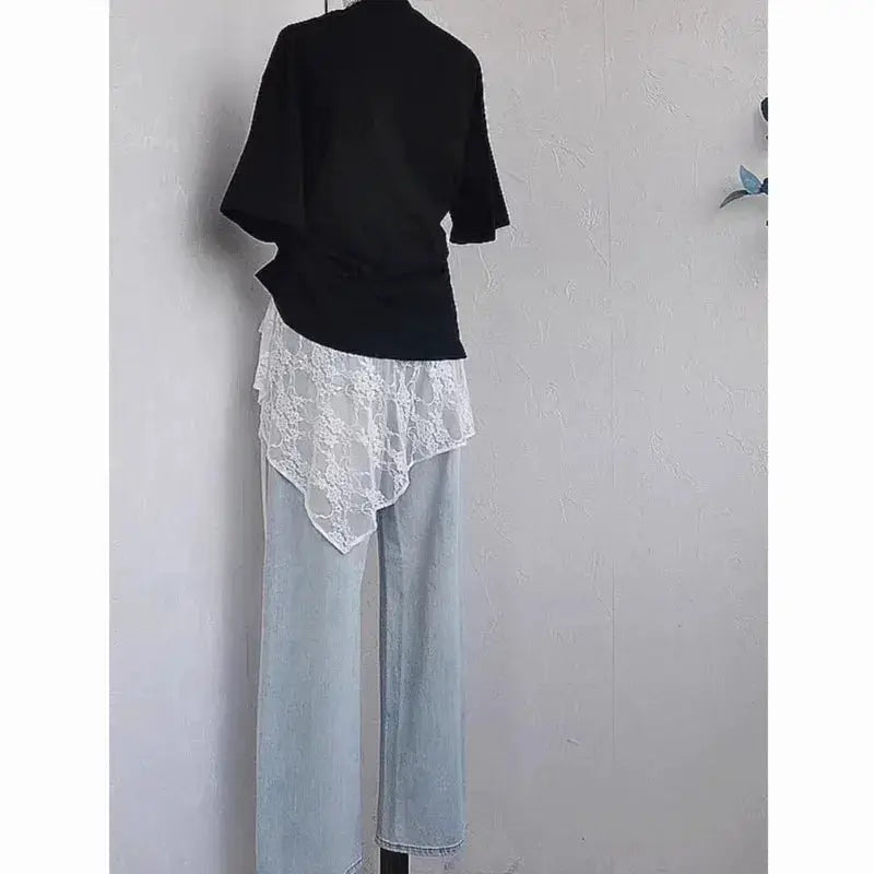 Simples Market wrap lace skirt with white floral lace overlay on light-wash denim, back view