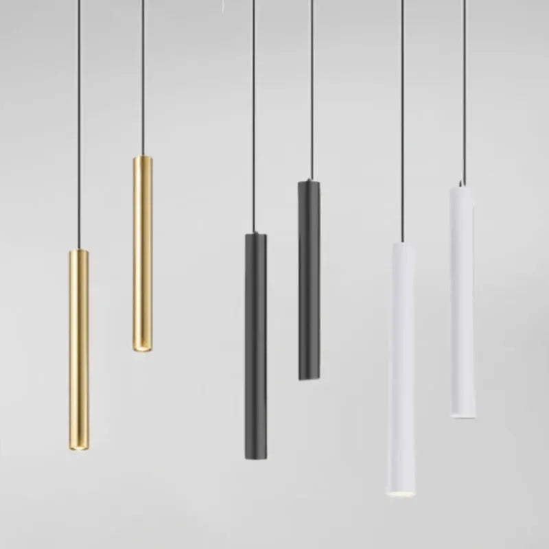 Six minimalist bedside LED pendant lamps in gold, charcoal gray, and white finishes by Simples Market