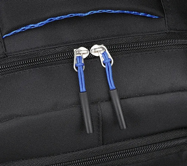 Backpack with blue zipper pulls on black fabric; unisex travel and school bag.
