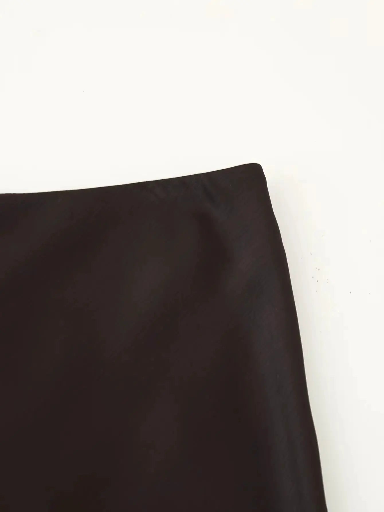 Dark brown satin half skirt with wrap-around styling and smooth glossy fabric