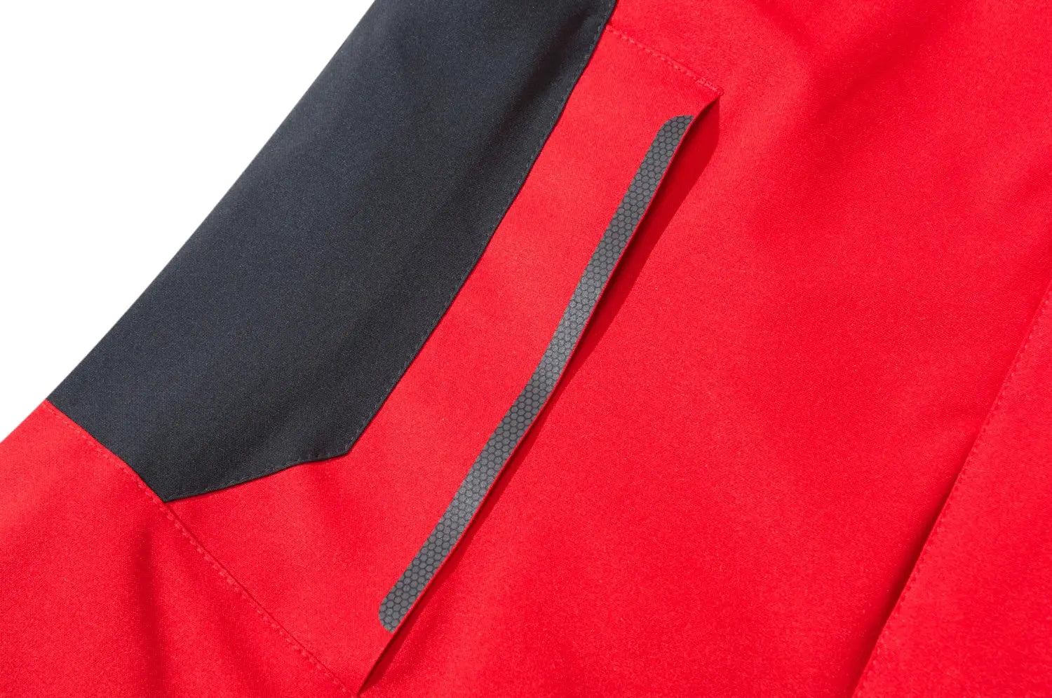 Men's red waterproof hiking jacket with black shoulder panel and gray zipper strip