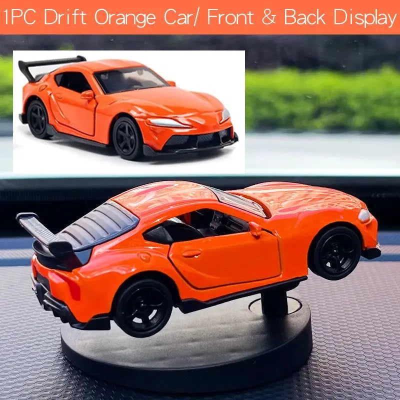 Orange drift car dashboard toy model by Simples Market on display with rear spoiler