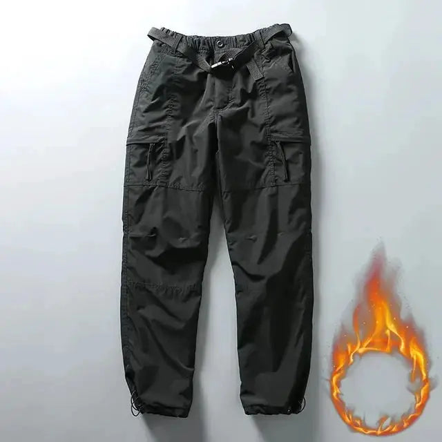 Tooling pants by Simples Market: black cargo pants with multiple pockets, belt, and adjustable ankle cuffs