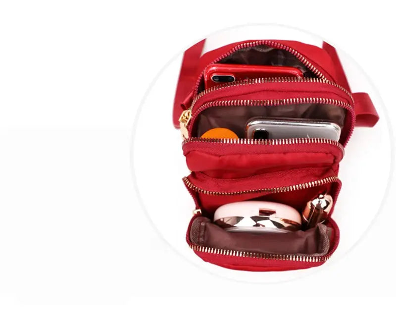 Crossbody bag red, Simples Market waterproof with multiple zip compartments for phone and cosmetics.