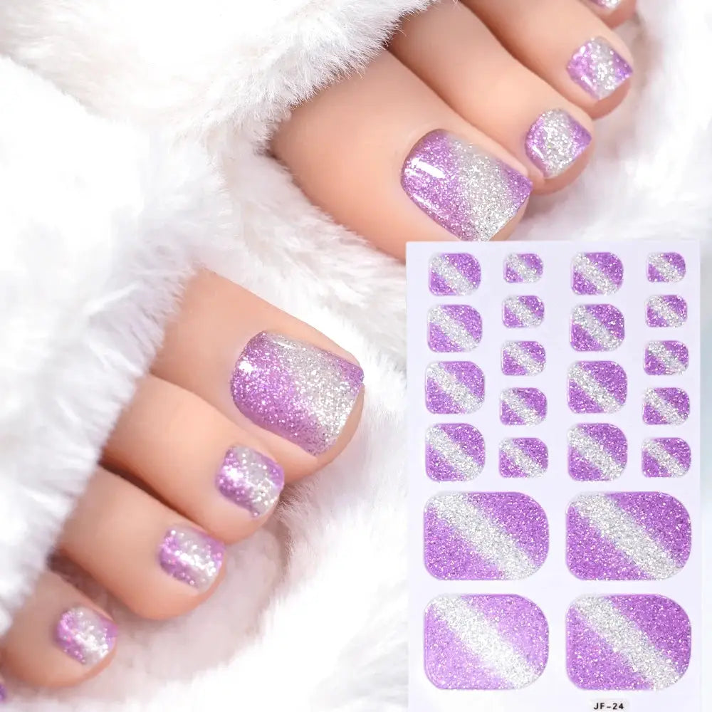 Toe nail sticker wraps in purple glitter gradient; full-cover self-adhesive decals with diagonal silver stripe, shown on a sheet