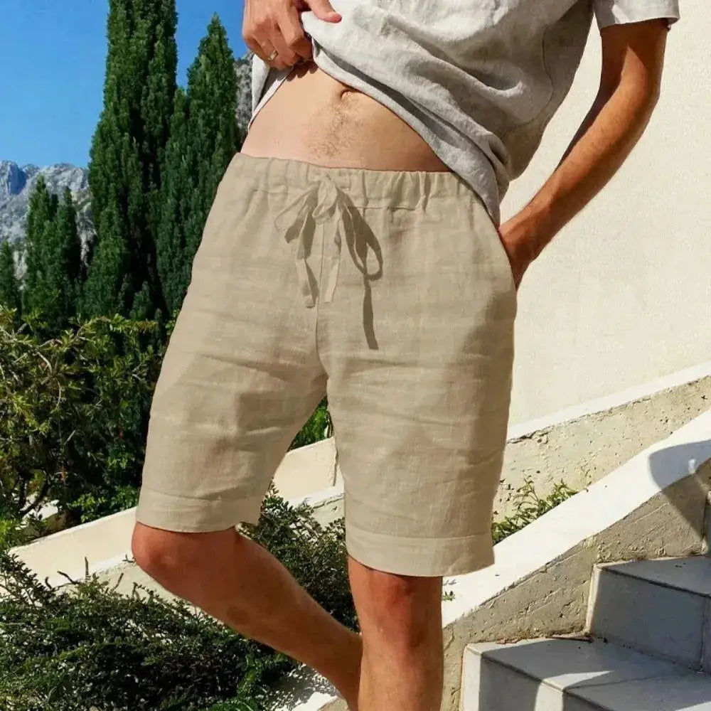 Men's beige cotton-linen shorts with drawstring, breathable loose-fit beachwear.
