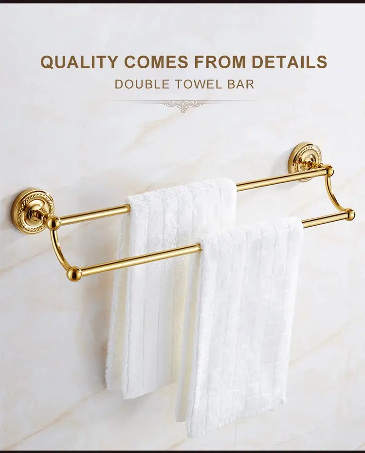 Gold brass double towel bar bathroom rack mounted on marble wall with white towels