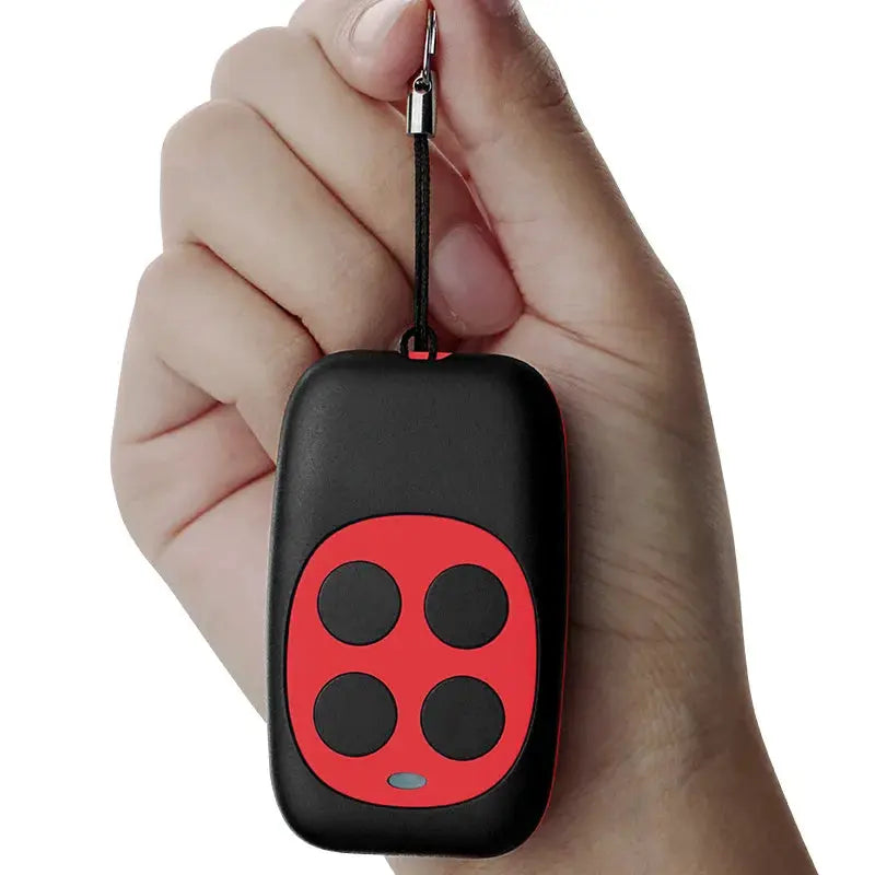 Simples Market 433MHz 4-key remote control key fob with red panel and black case on a lanyard