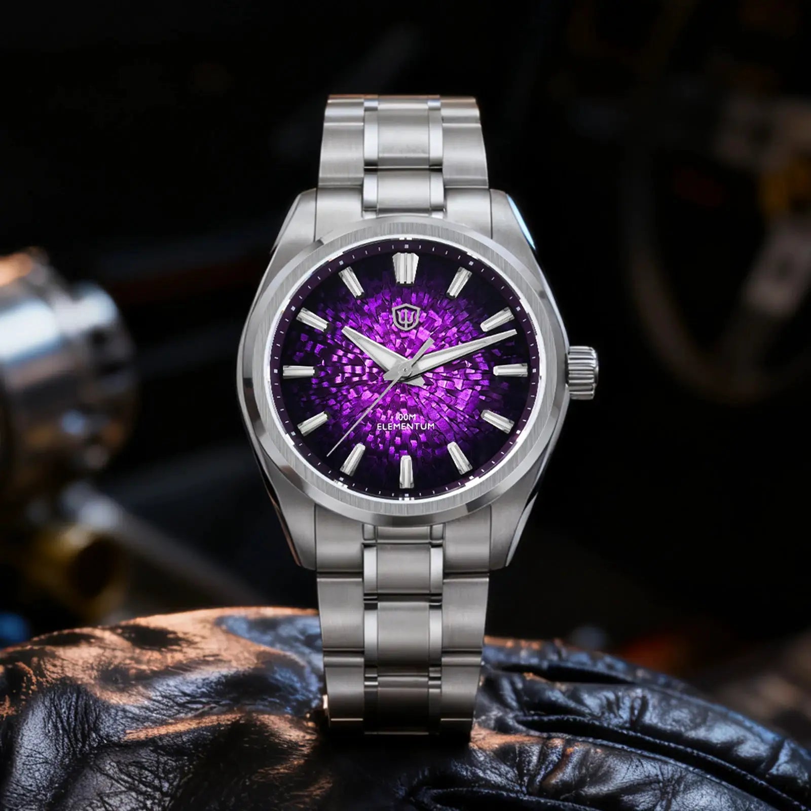 Stainless steel wristwatch with purple ice-crack dial, 38mm case and brand shield logo on dial