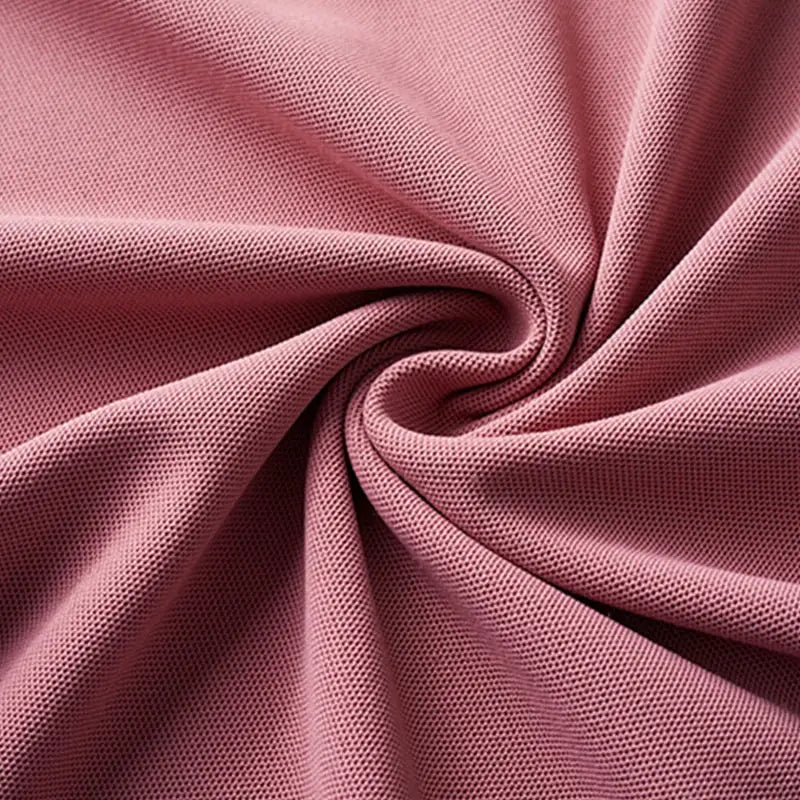 Men's pink polo shirt by Simples Market; knit fabric close-up