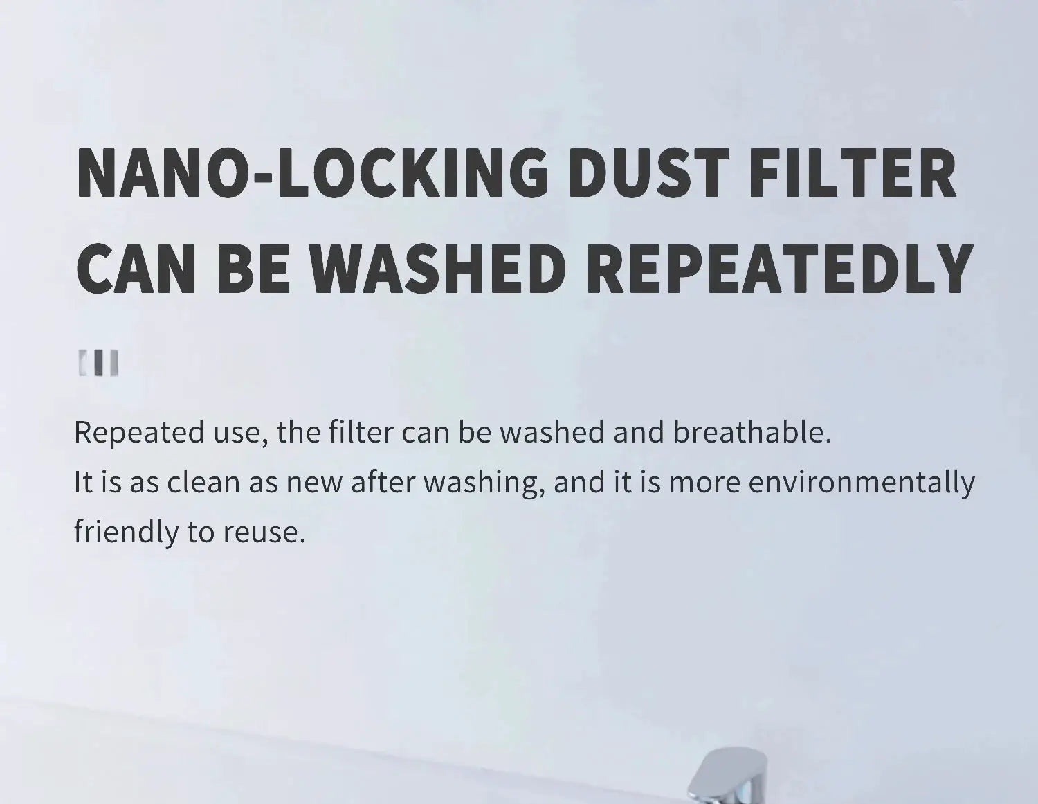 Nano-locking dust filter sign on a pale wall stating it can be washed and reused.