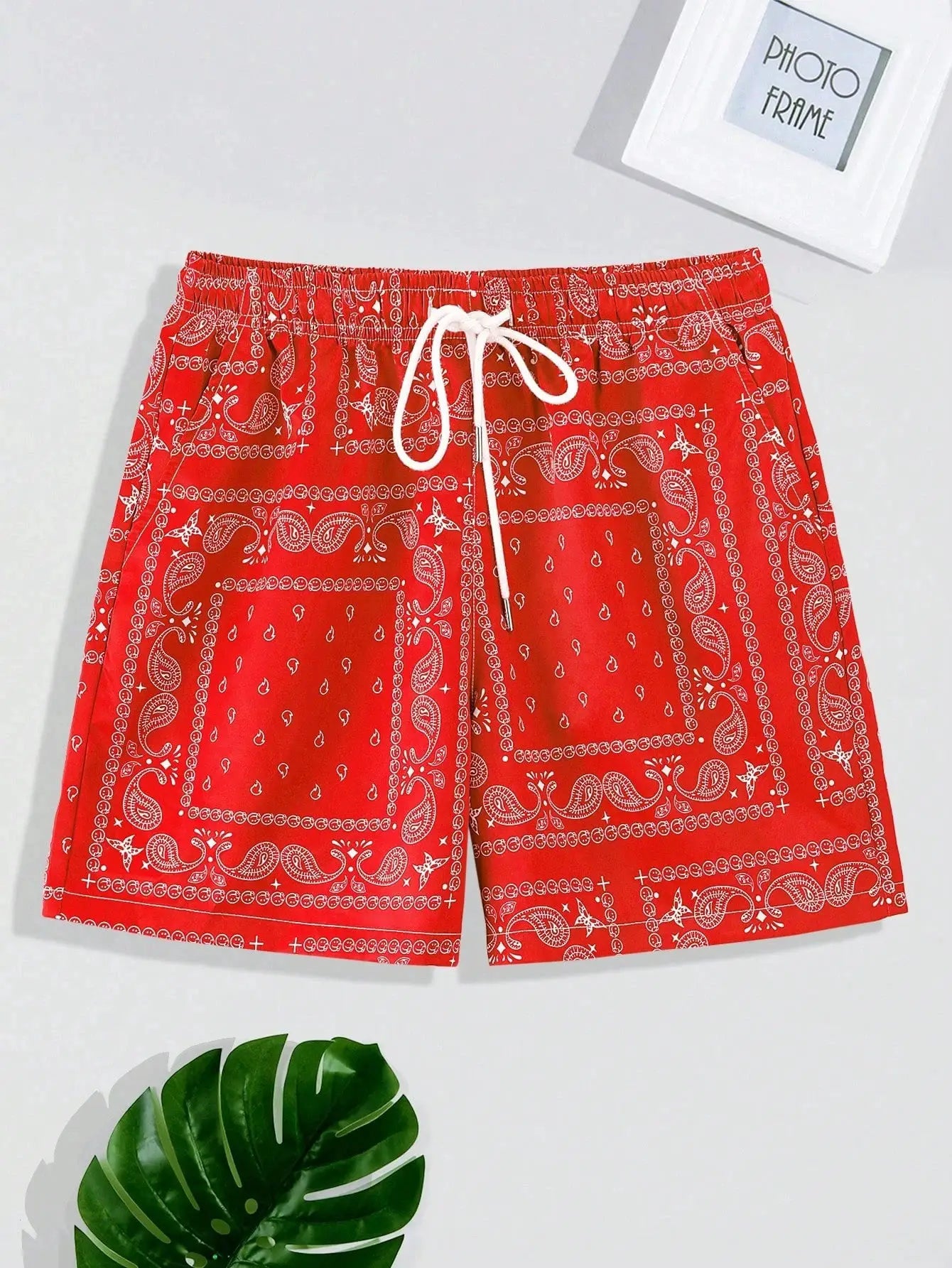 Men's red bandana-pattern beach shorts with white drawstring, casual swim trunks