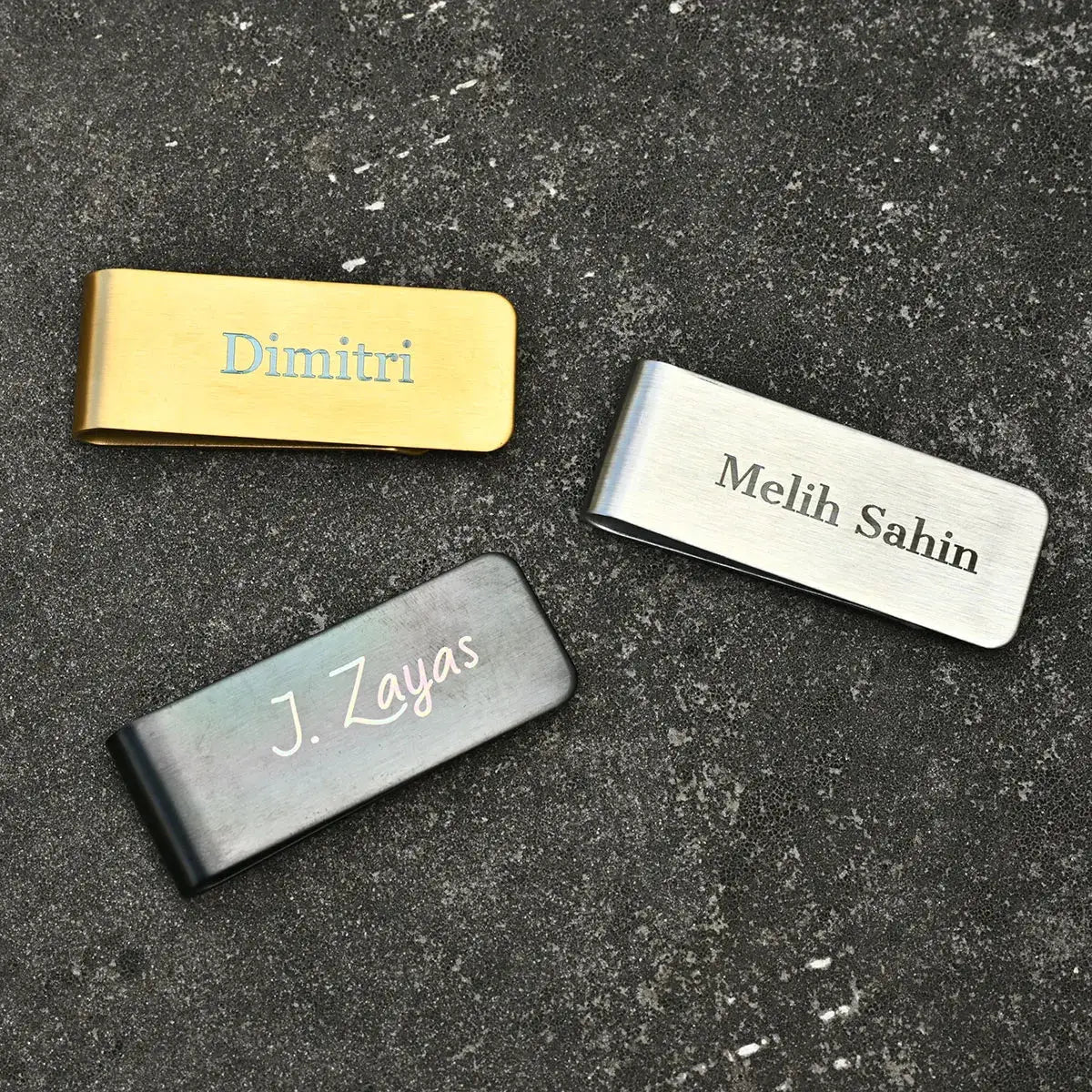 Three personalized money clips in gold, silver and gunmetal with engraved names