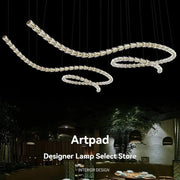 Chandelier ceiling light with multi-strand clear crystal acrylic beads and adjustable chain for living room.