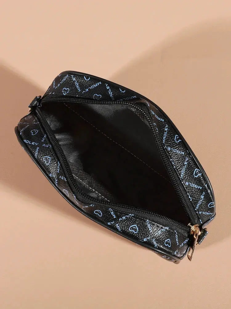 Fashion crossbody bag by Simples Market, black faux leather with blue heart pattern and zip closure.