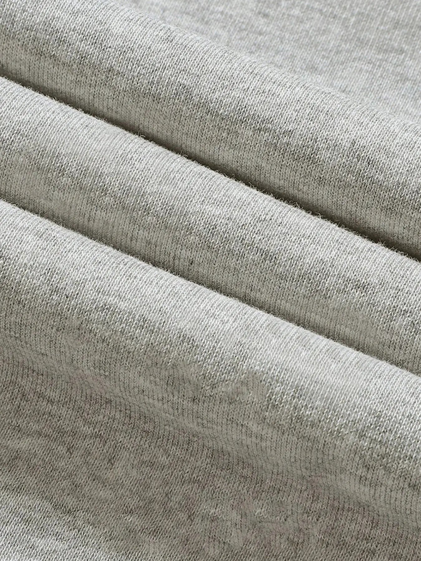 Men's jogging pants fabric close-up in gray heather; breathable and baggy style by Simples Market