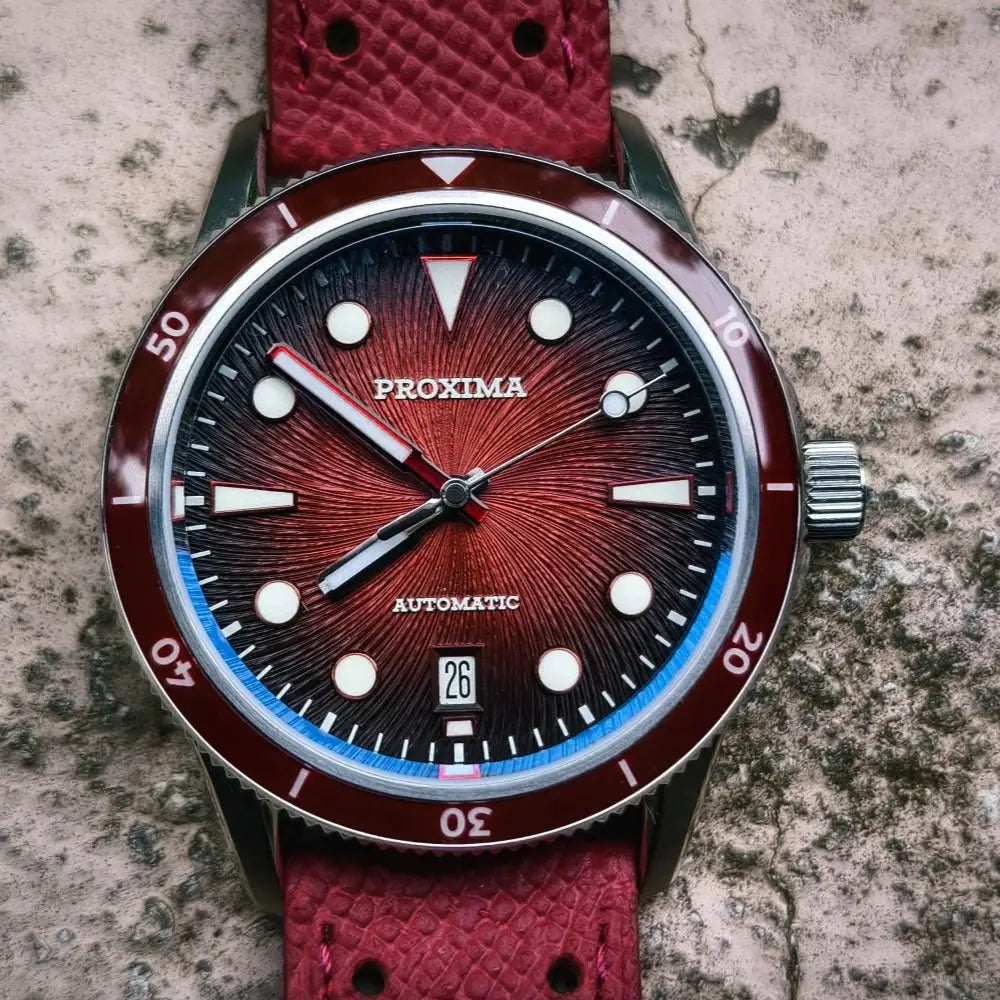 Proxima dive watch with red sunburst dial, luminous markers, 39mm case, automatic movement, date window, red bezel