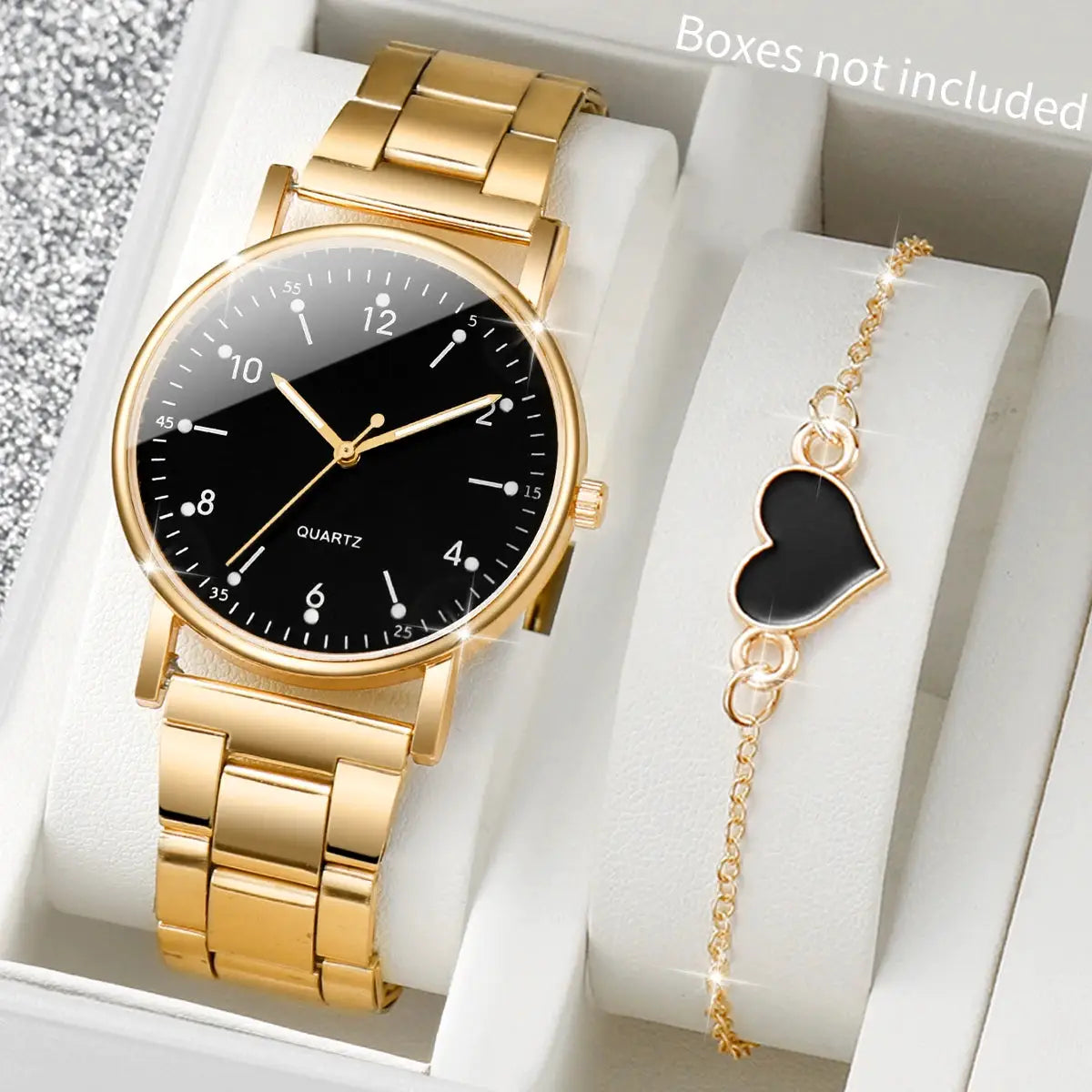Gold-tone women's quartz watch with black dial and matching gold bracelet with a black heart charm, 2-piece set