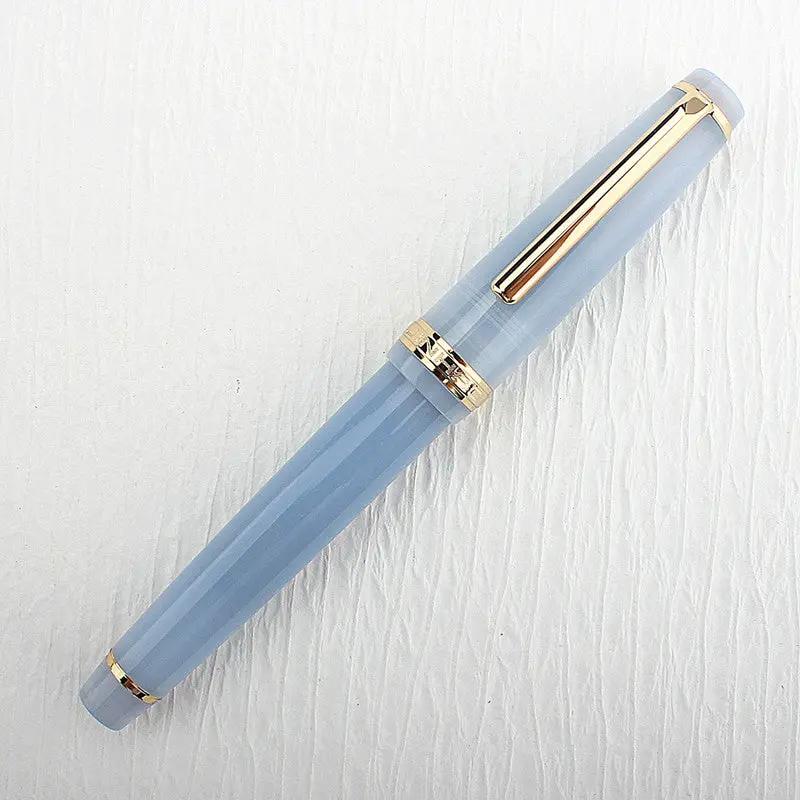 Jinhao 82 fountain pen in light blue acrylic with gold trim and clip, converter included