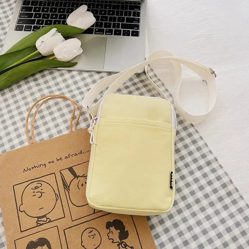 Simples Market pale yellow vertical phone bag with white crossbody strap