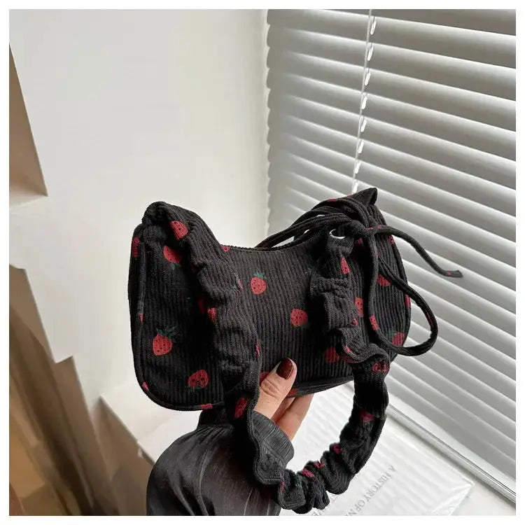 Corduroy strawberry-print mini shoulder bag, black, compact underarm style, by Simples Market for everyday use.