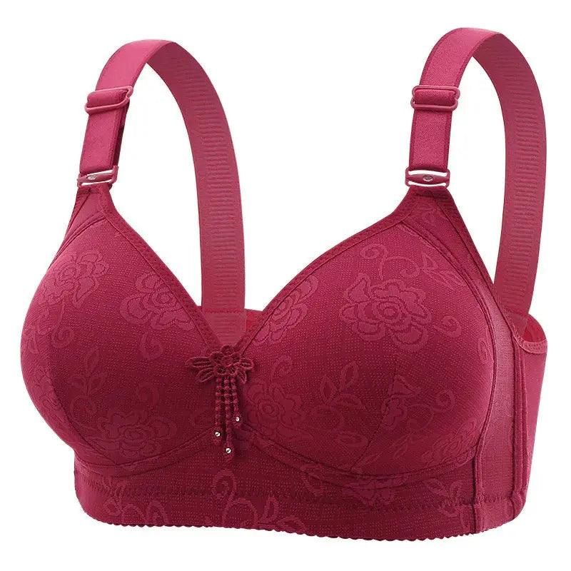 Pink glossy non-underwire bra with wide adjustable straps, floral pattern and front decorative charm
