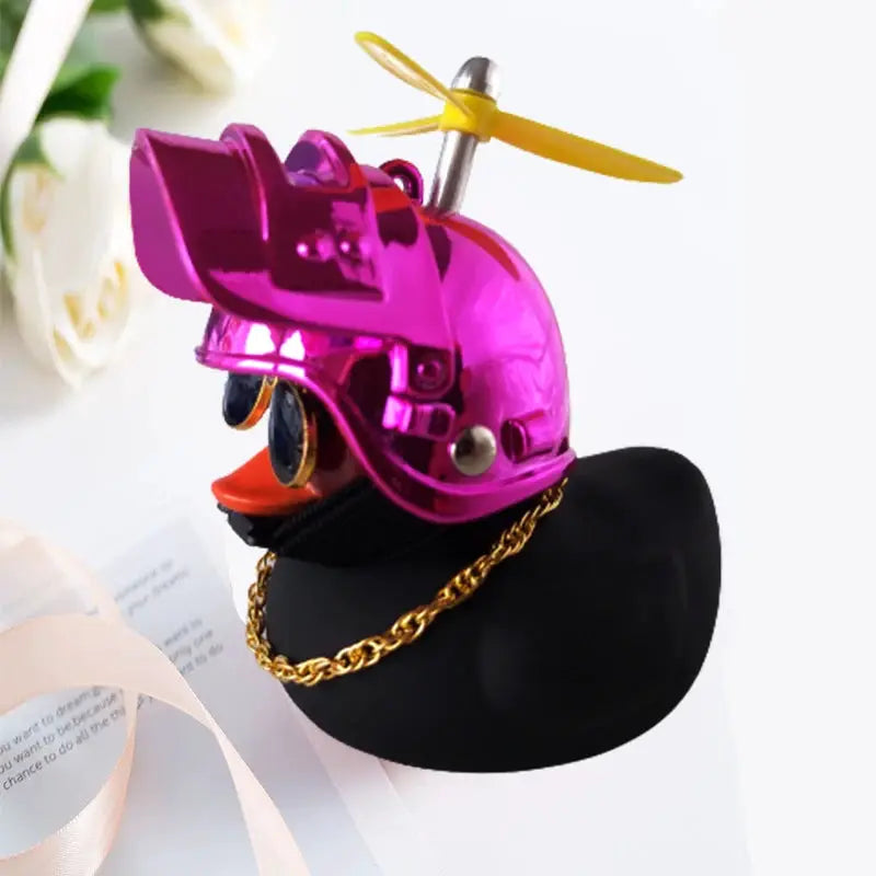 Simples Market rubber duck car ornament with pink metallic helmet and yellow propeller