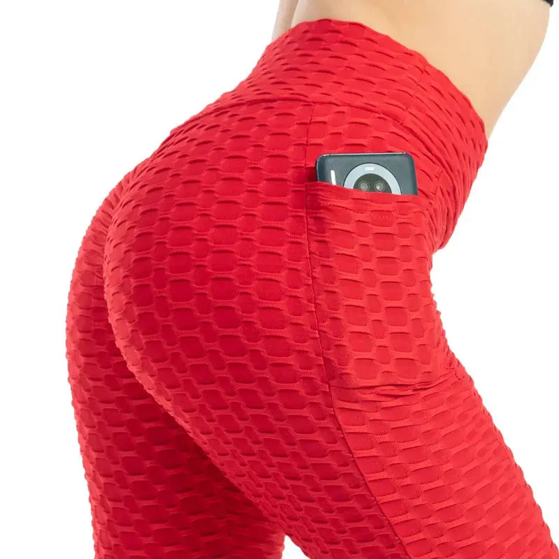 Pocket bubble leggings in red with high waist and side phone pocket for gym.
