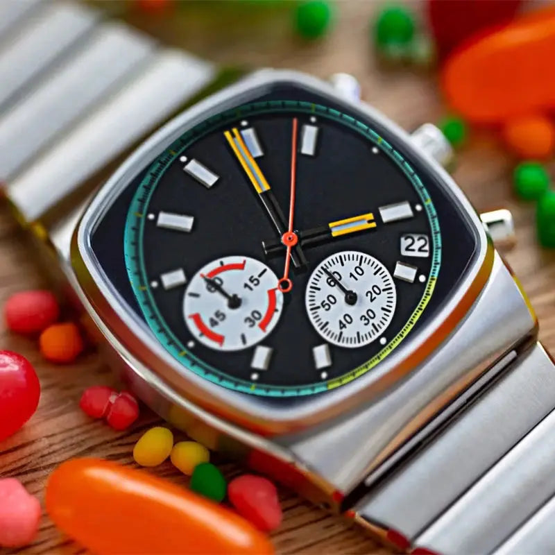 CILOA square men’s watch, stainless steel case and bracelet, black dial with white subdials and teal bezel