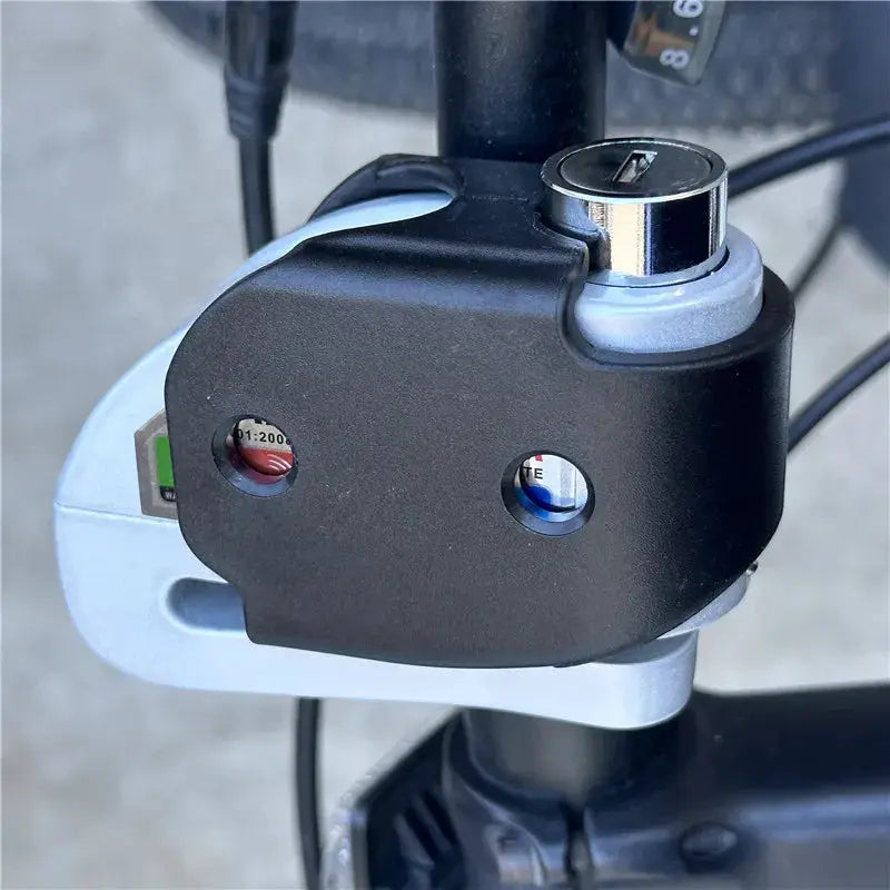 Falante alarm disc lock for motorcycles, black aluminum alloy with chrome cylinder on handlebar.