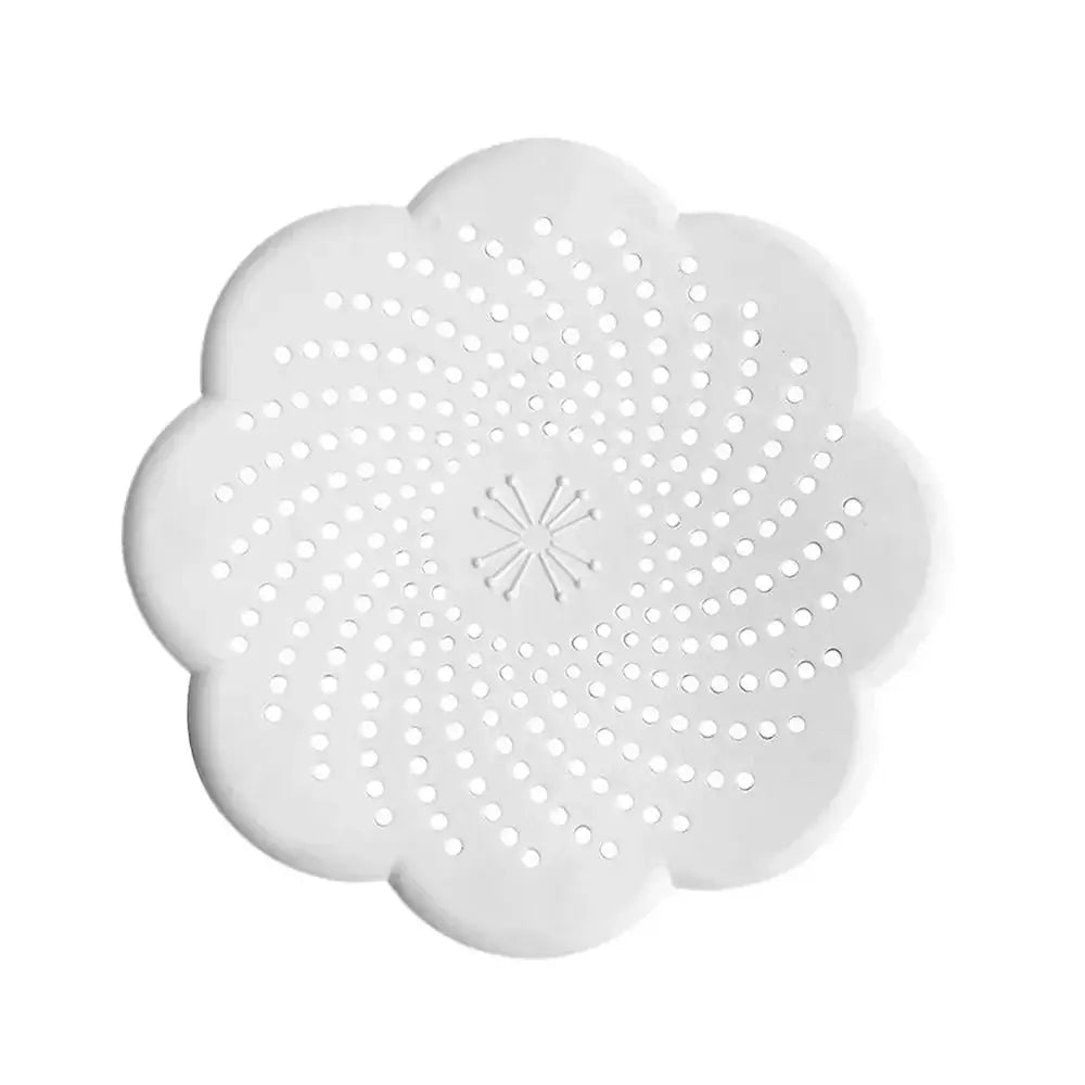 Silicone flower drain cover by Simples Market, white flower-shaped sink strainer with perforations