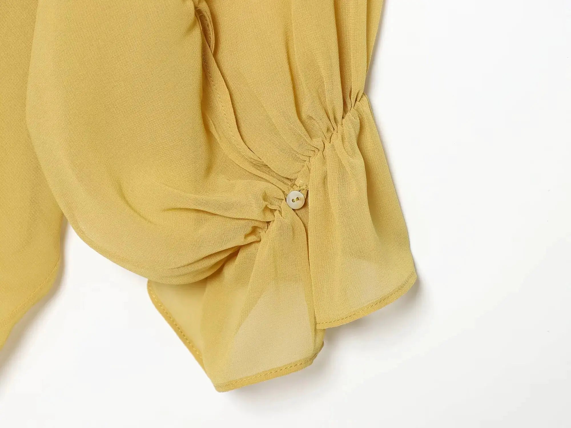 Women's mustard-yellow sheer blouse with lantern sleeves and front tie knot