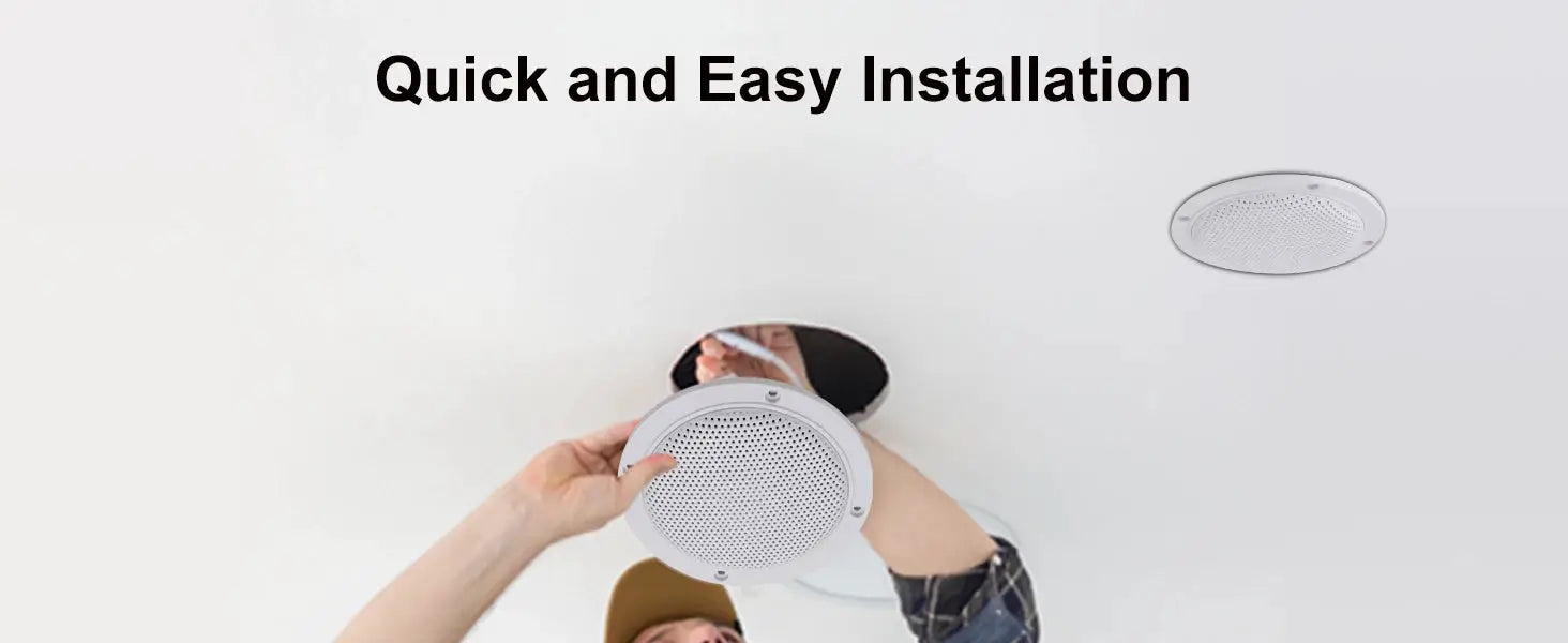 White ceiling speaker being installed; two round ceiling speakers visible.