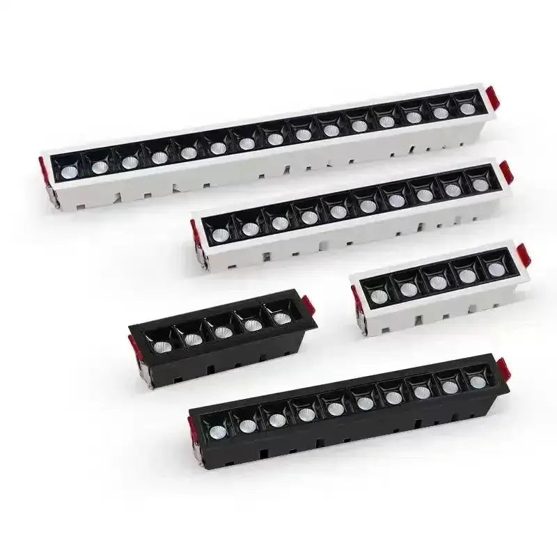 Six rectangular LED line downlights in white and black recessed housings with grille design