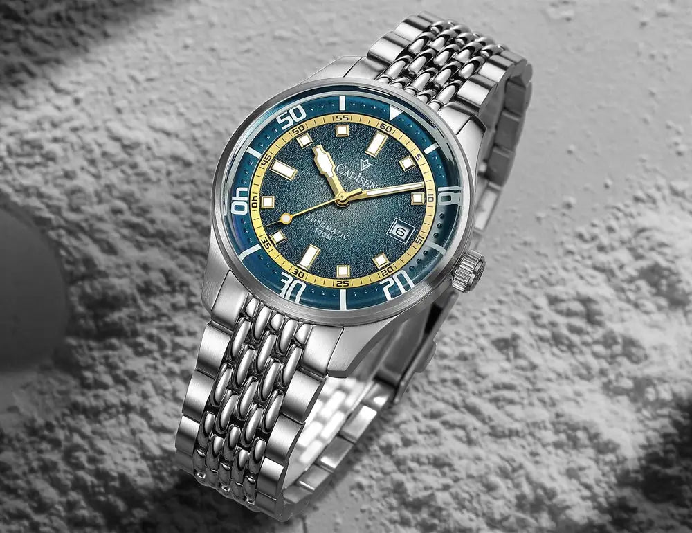 CADISEN men's automatic watch with blue dial, yellow ring, domed glass, stainless steel bracelet, 100m water resistant