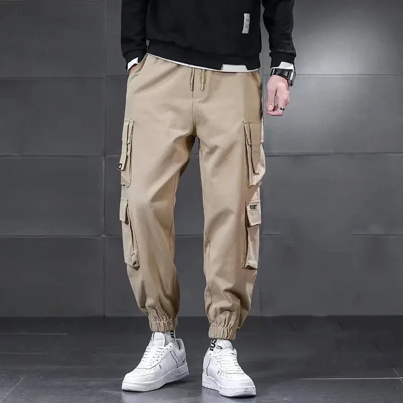 New Winter Lambswool outdoor waterproof cargo pants for men in beige with multiple pockets and elastic cuffs.