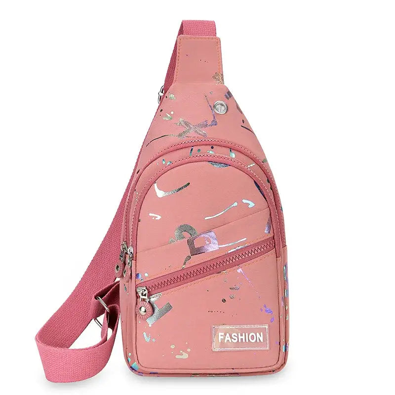 Pink chest bag crossbody sling backpack with abstract print, front zippered pocket and adjustable strap