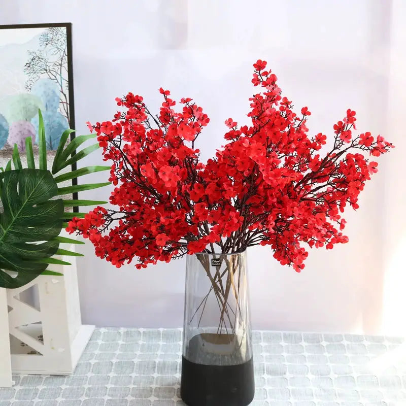 Artificial cherry blossom gypsophila branches by Simples Market in a clear glass vase with black base