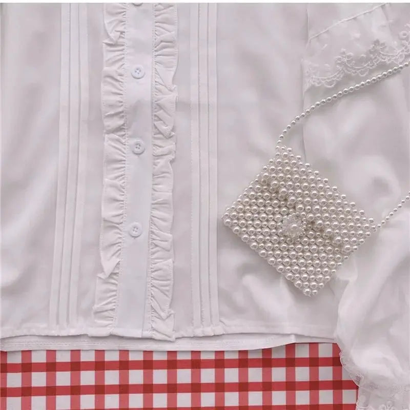 White Lolita blouse with ruffled front placket and lace trim; 1 pearl-bead handbag on red gingham background