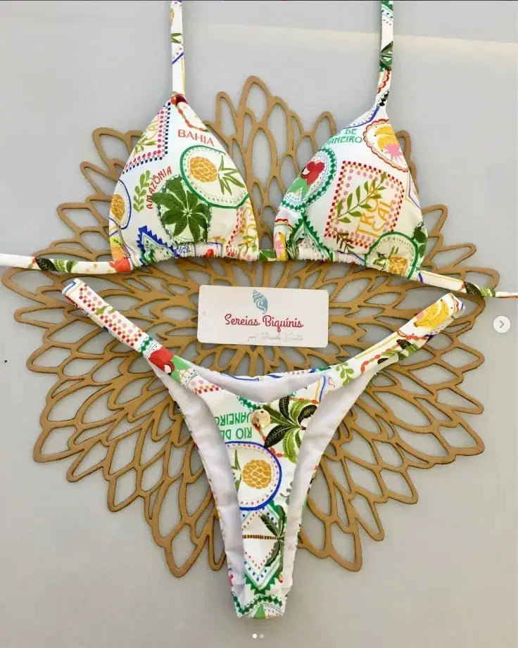 Simples Market two-piece bikini set with halter top and thong bottom in tropical multicolor print