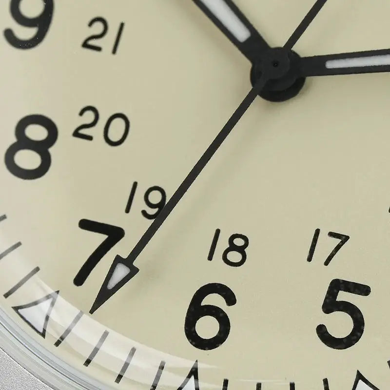 Militado ML07 quartz military watch dial close-up with cream face and black luminous hands