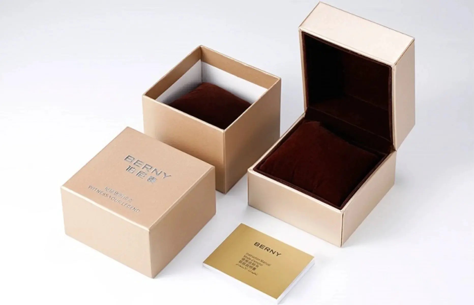 BERNY watch packaging set: three beige boxes with brown velvet interiors, BERNY branding visible