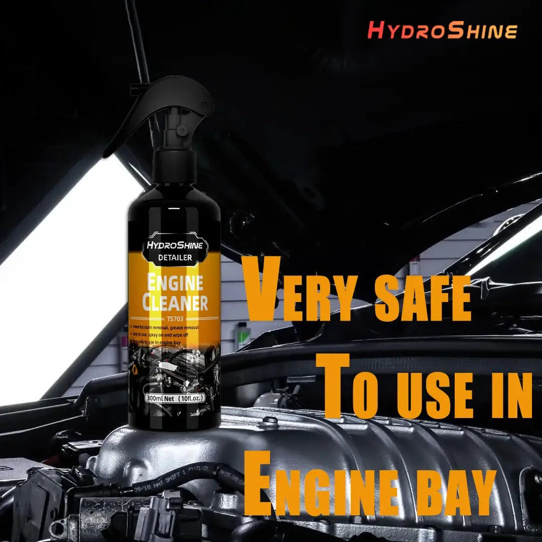 HydroShine Engine Cleaner spray bottle with orange label, black bottle in a car engine bay.