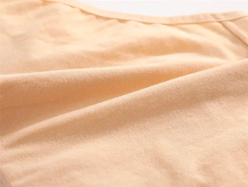 Cotton women's panties fabric close-up in nude peach color