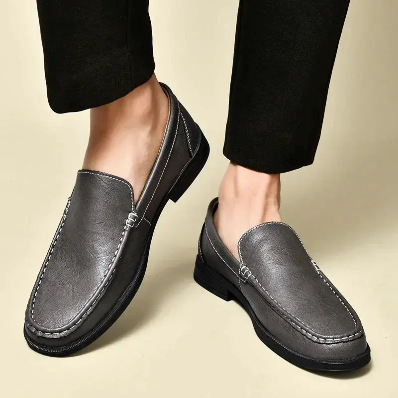 Simples Market leather men's gray slip-on loafers with white stitching, dress/moccasin style pair