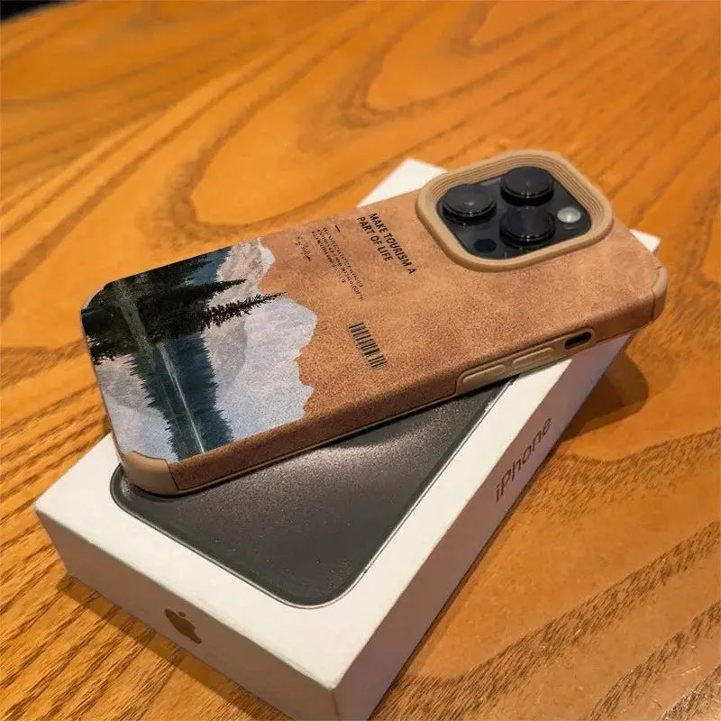 iPhone case with brown faux-leather finish and mountain lake scenery motif